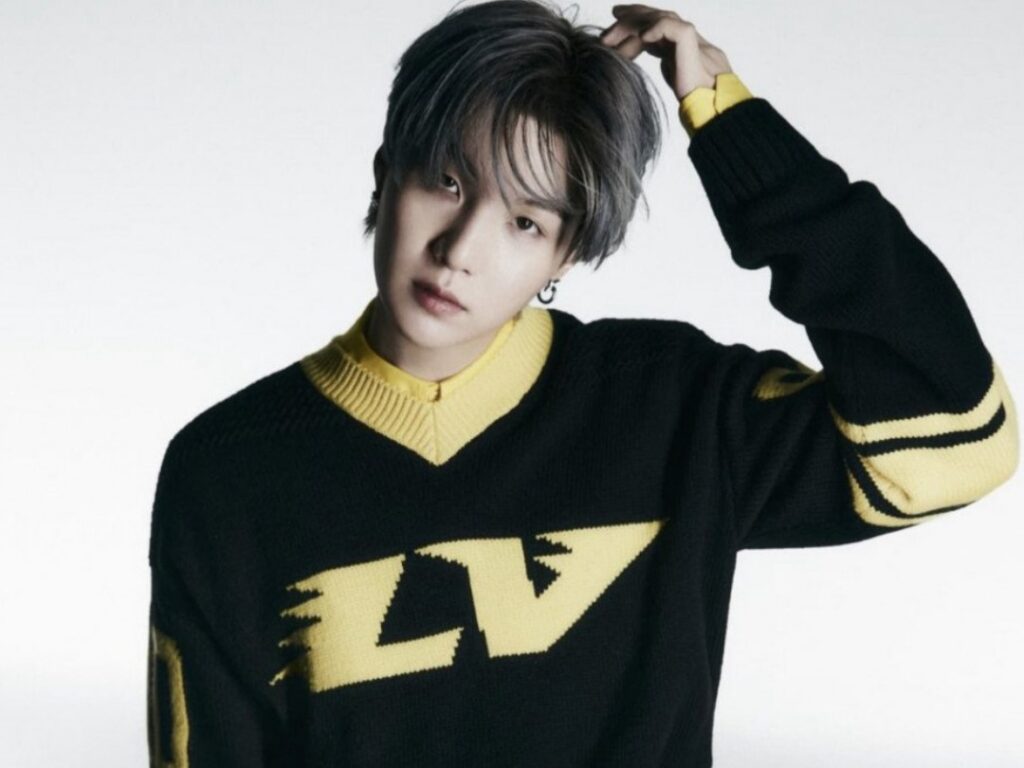 Suga holding Halsey's baby in a cute photo. Check out