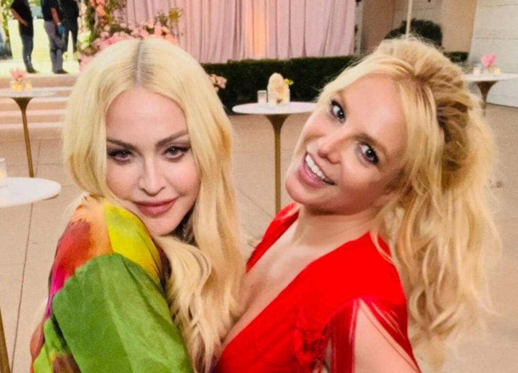 After getting married Britney Spears and Madonna recreate their iconic VMAs kiss