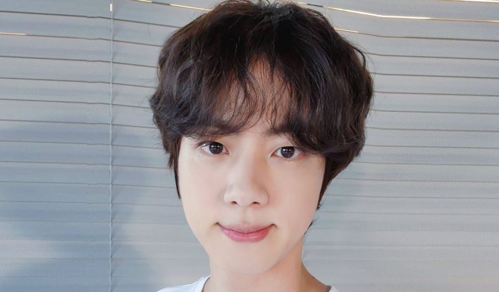 BTS' Jin epically responds to fan who criticized him for touching a girl's hand