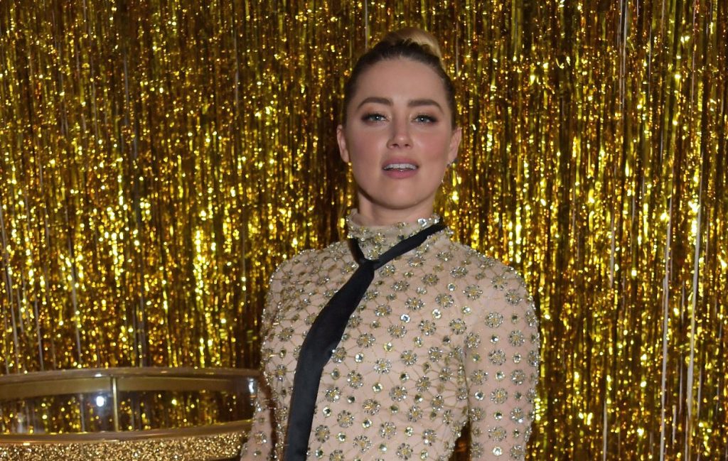 Amber Heard says she won't give up until she takes Johnny Depp to a new trial