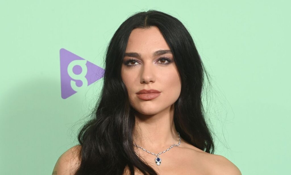 Dua Lipa joins the season's hottest trend with fancy silver boots