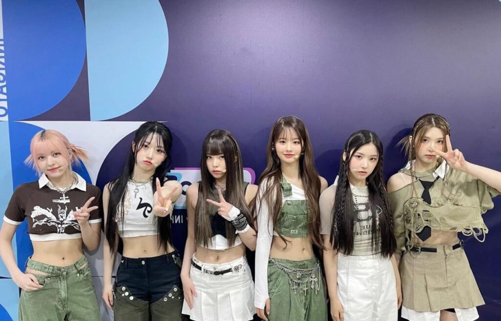 Someone threw a baby onto stage in the middle of an NMIXX concert