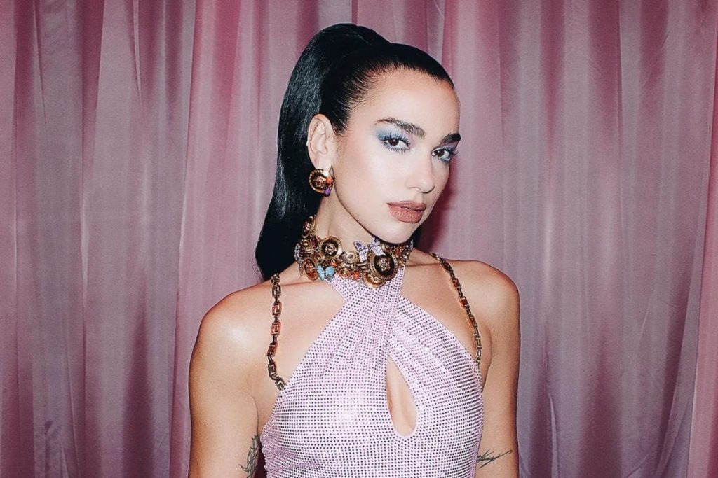 Dua Lipa reveals that her outfit for the summer is a Versace string bikini that she designed herself