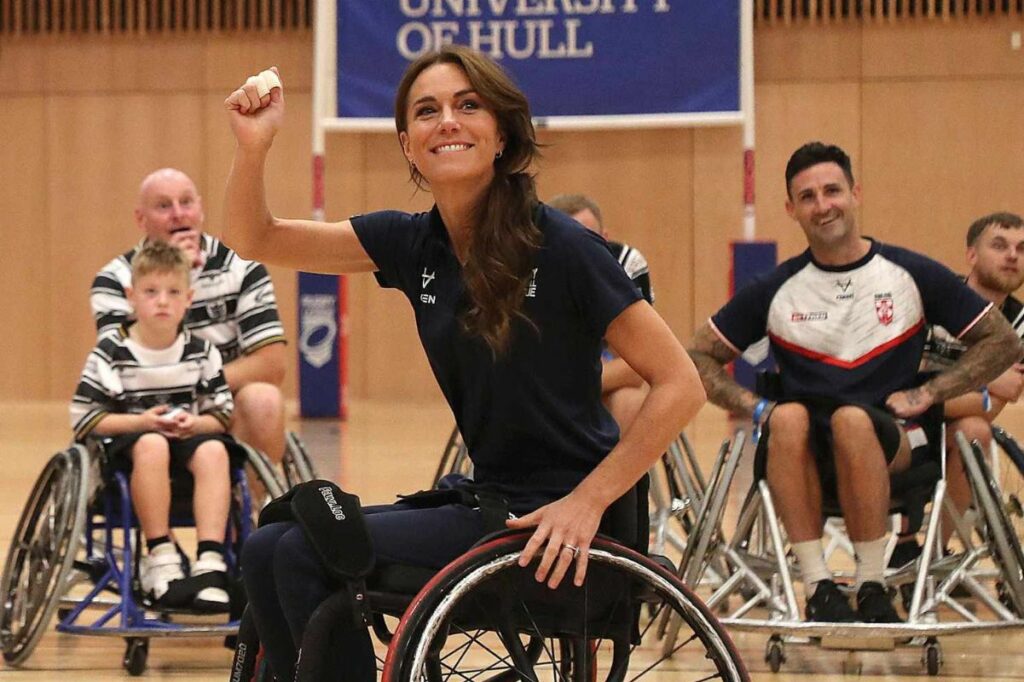Kate Middleton appears with "bandaged" hand and in wheelchair