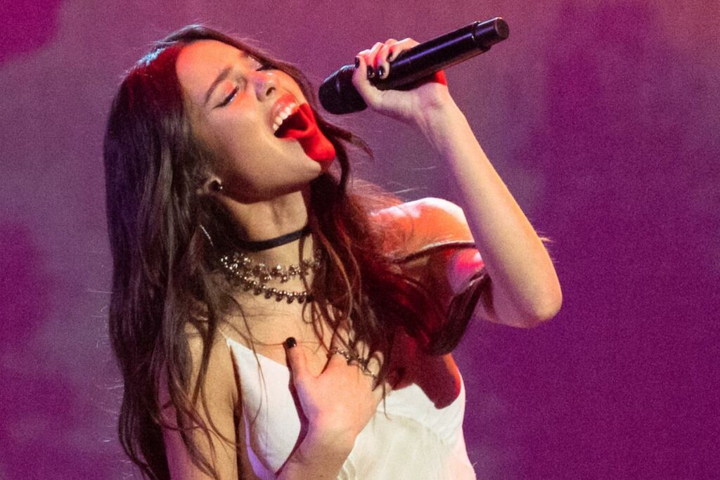 Olivia Rodrigo spills the tea about the making of her album during a United States show
