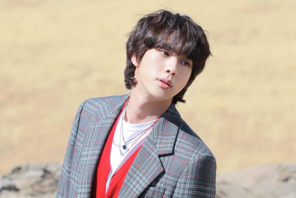 BTS' Jin prepares traditional Korean wine dressed in his military combat uniform