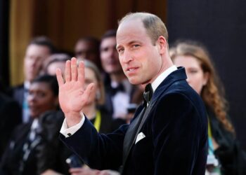 Prince William visits a school after being invited by a young student