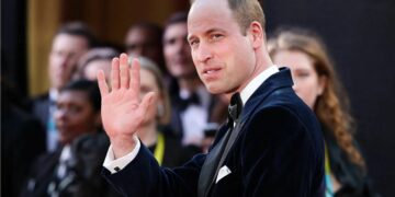 Prince William visits a school after being invited by a young student