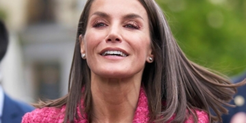 Queen Letizia makes a gesture of pain caused by the injury to her right foot