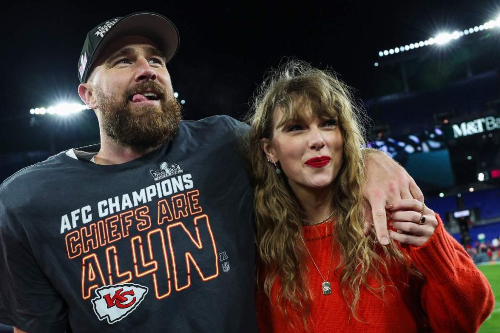 Travis Kelce gives off husband vibes at Taylor Swift charity auction