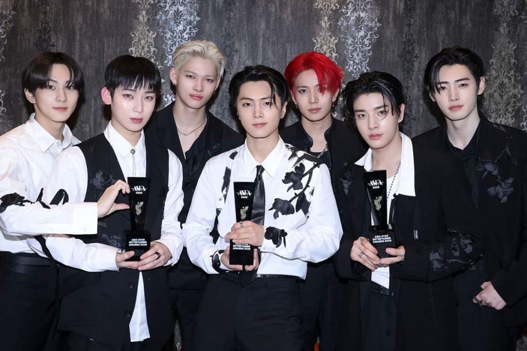 ENHYPEN holding an award