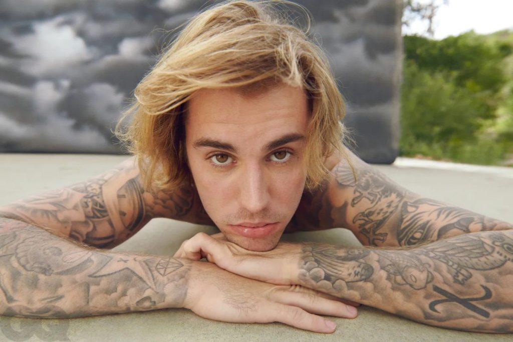 Justin Bieber stuns with a new clean-shaven look during a concert with wife Hailey in San Diego