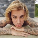 Justin Bieber stuns with a new clean-shaven look during a concert with wife Hailey in San Diego