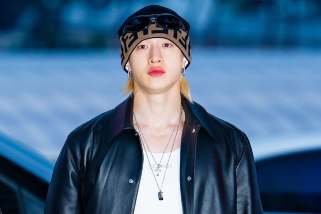 Bang Chan walks around the Stray Kids recording set shirtless