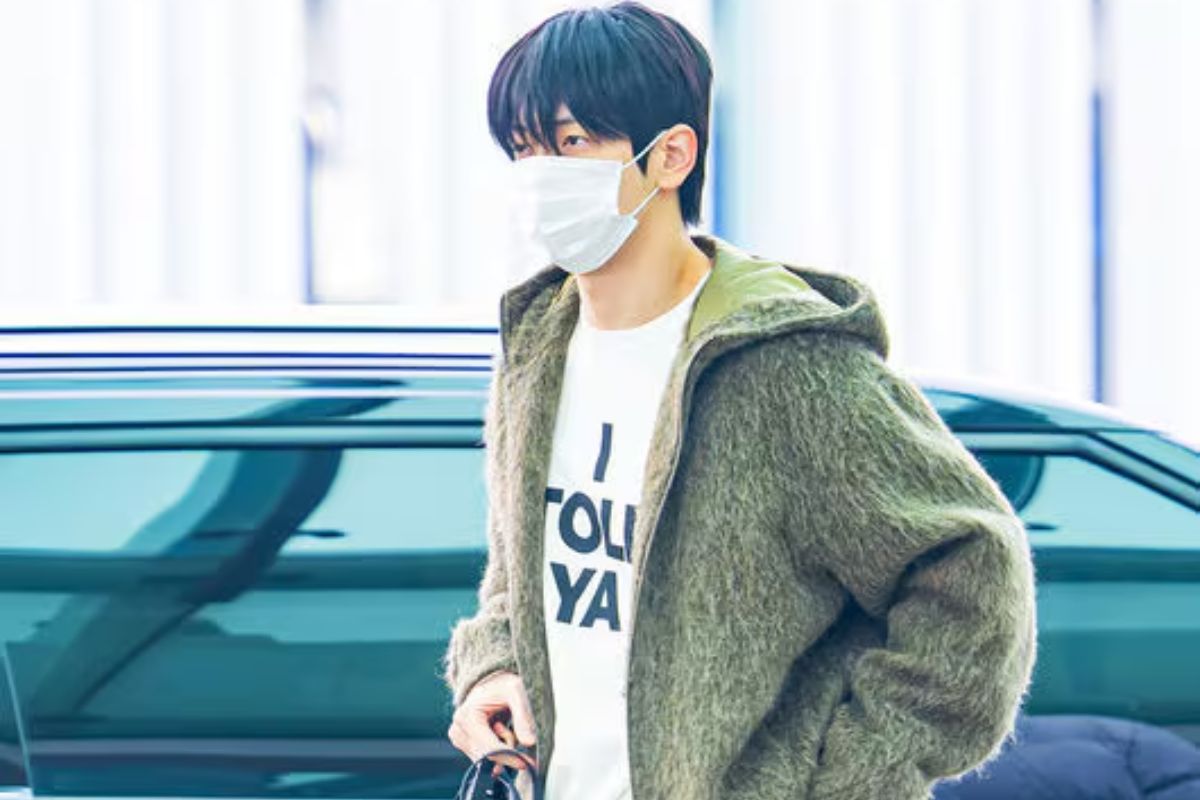 Soobin wearing mask, I Told Ya T-shirt and green jacket
