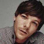 One Direction’s Louis Tomlinson says “What Makes You Beautiful” felt corny to perform