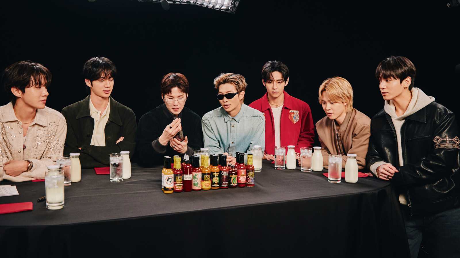BTS appears on Hot Ones and turns the interview into a chaotic group test