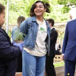 King Charles receives a hair compliment from a child during his Harlem visit