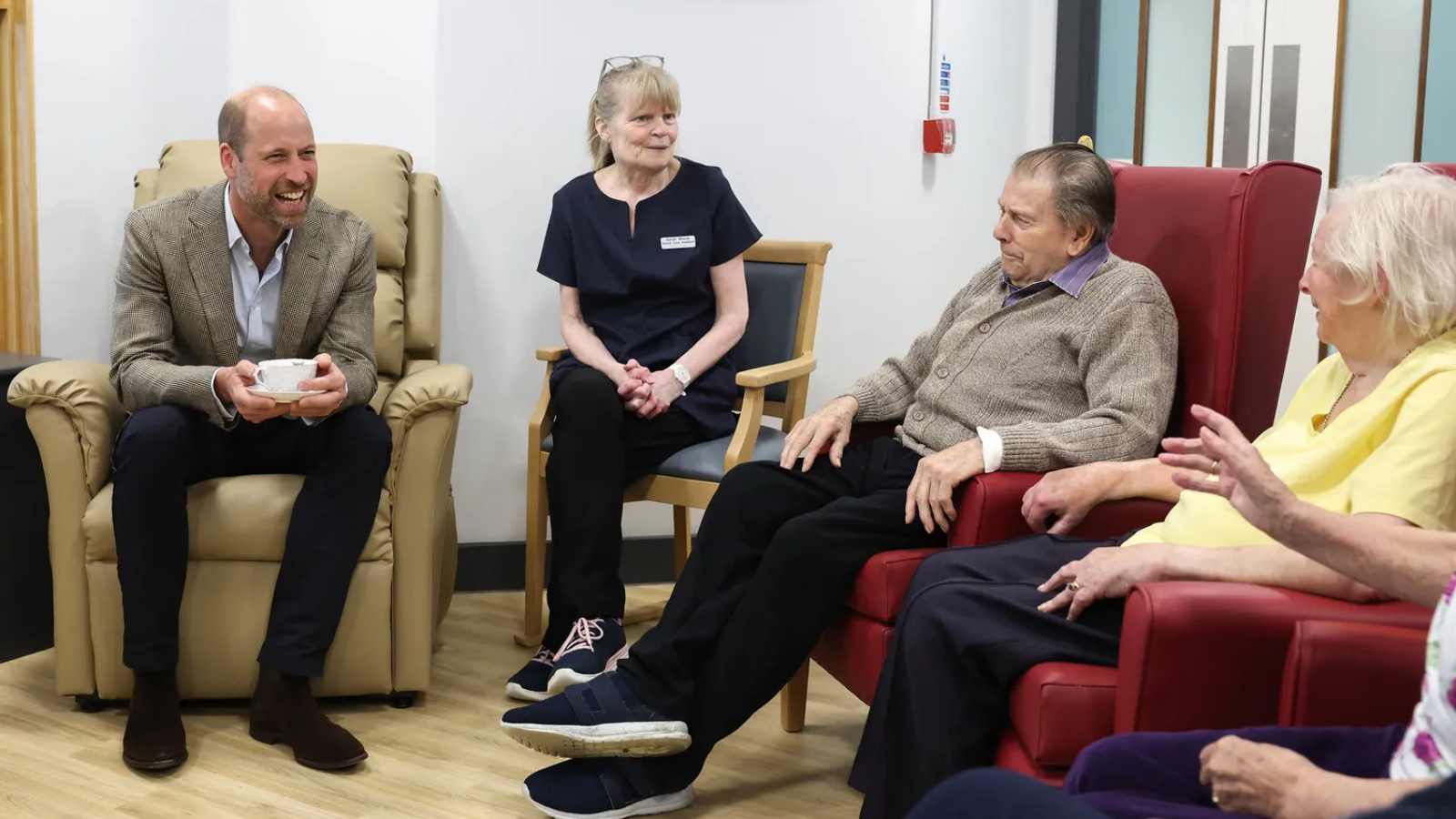 Prince William laughs during a flirty interaction with a 94-year-old woman at a hospital visit Prince William laughs during a flirty interaction with a 94-year-old woman at a hospital visit