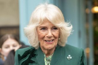 Queen Camilla serves Guinness during a surprise visit to Northern Ireland