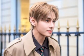 BTS' V gives a jacket to a fan at a concert for the second time