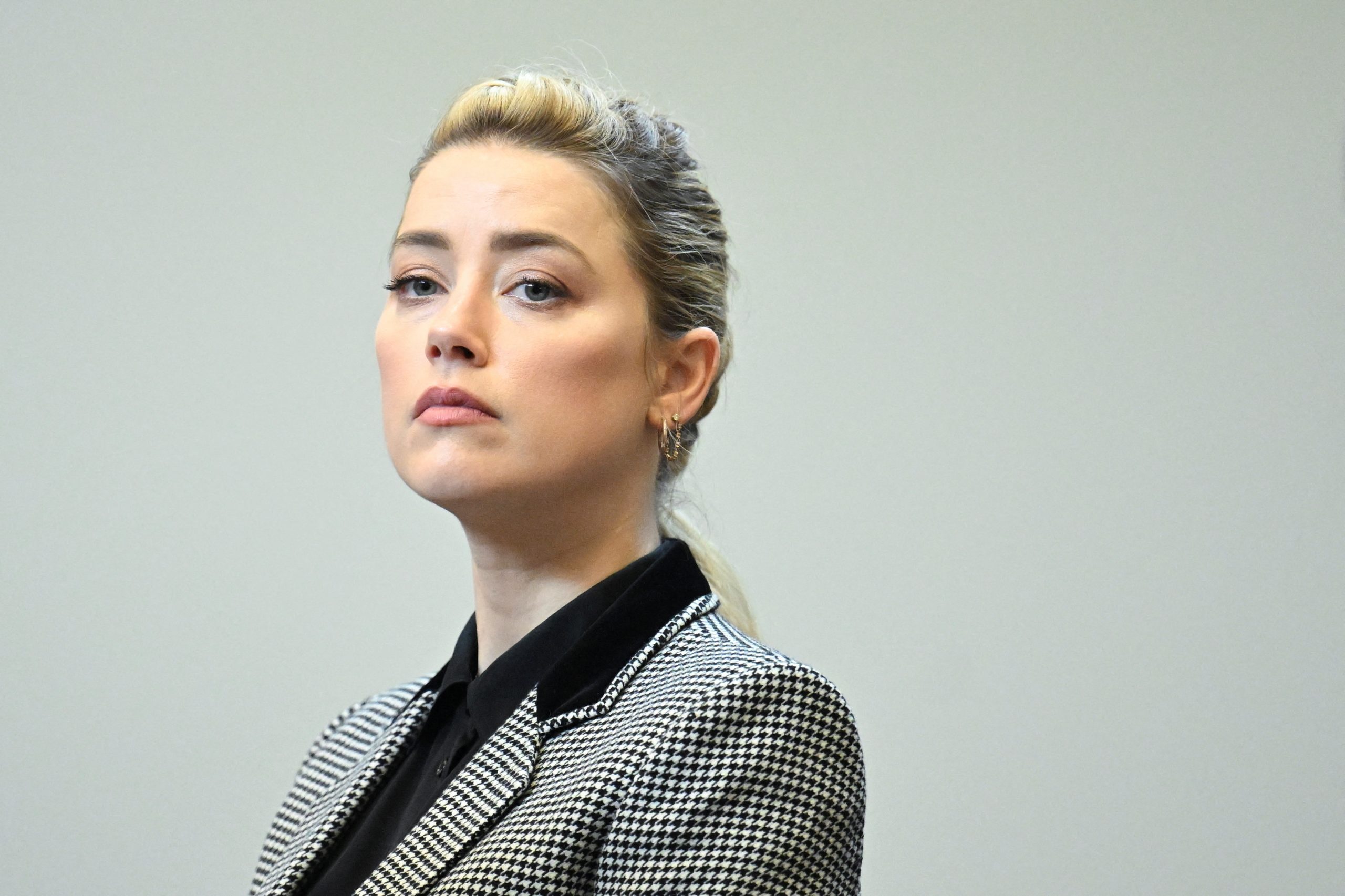 Actor Amber Heard looks on during actor and her ex-husband Johnny Depp's defamation case against her, in the courtroom at the Fairfax County Circuit Courthouse in Fairfax, Virginia, U.S., May 24, 2022. Jim Watson/Pool via REUTERS